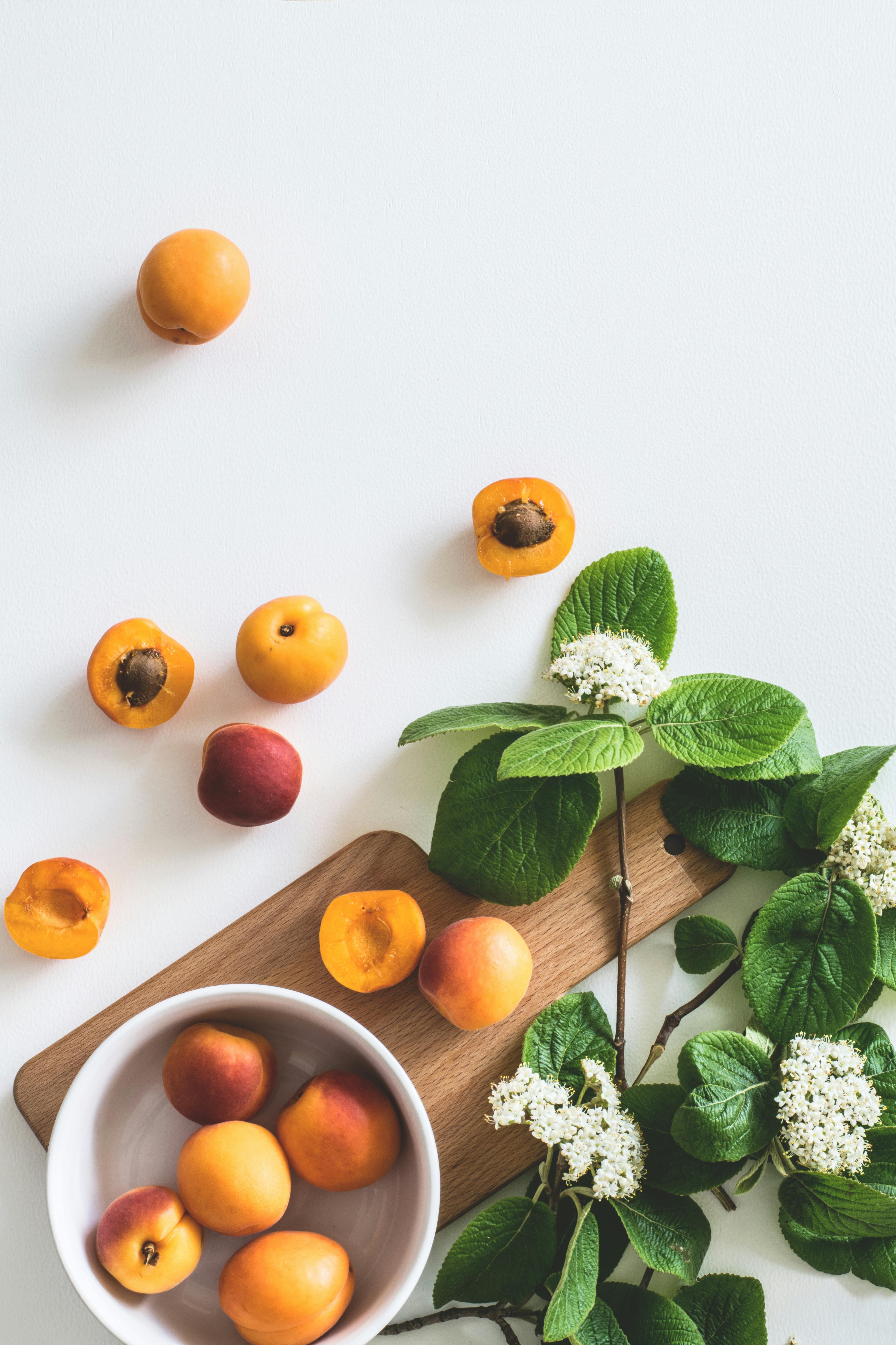 Apricot Fruit and Kernels on White Background