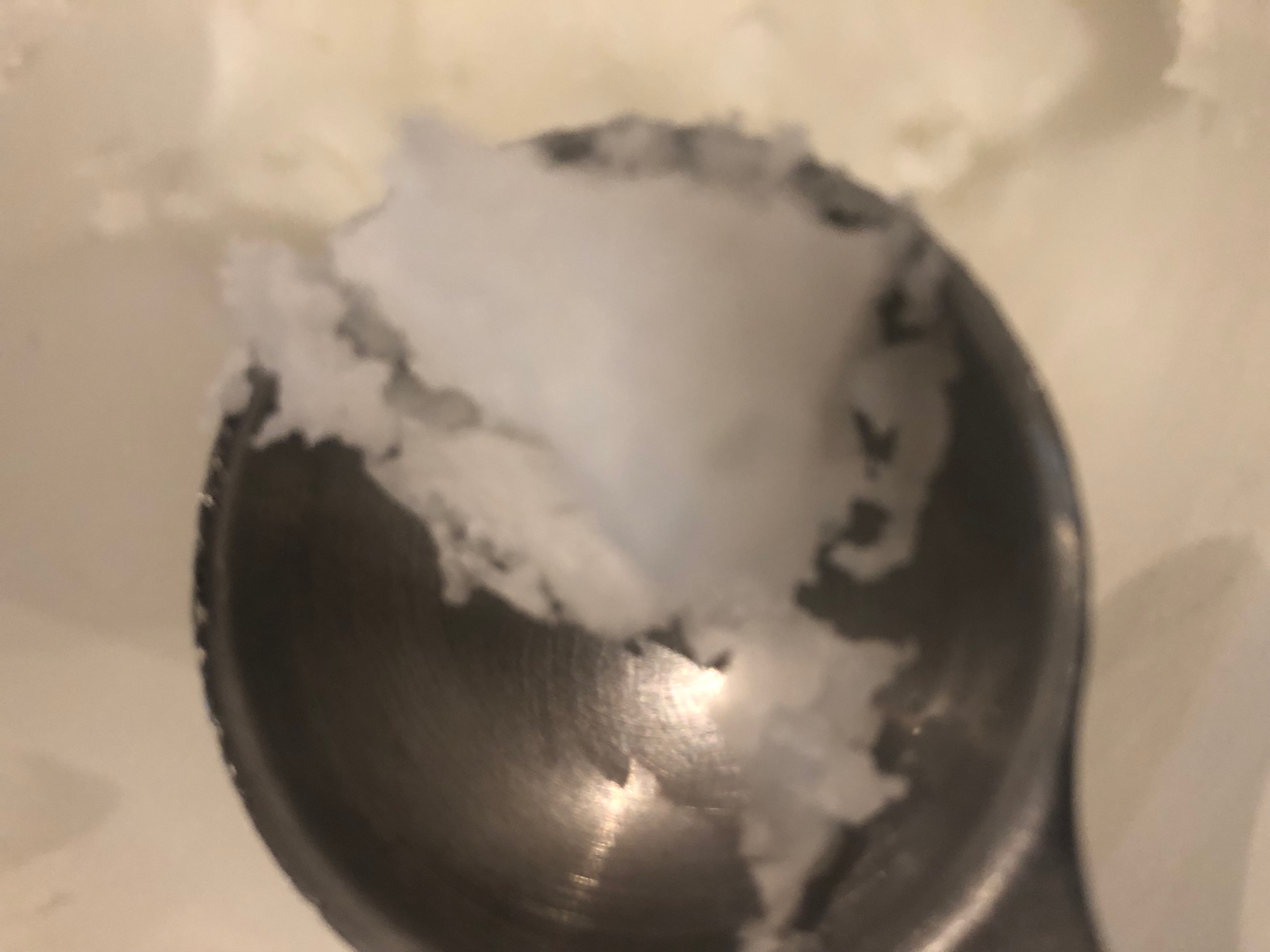 Unrefined Babassu Butter in a Measuring Spoon