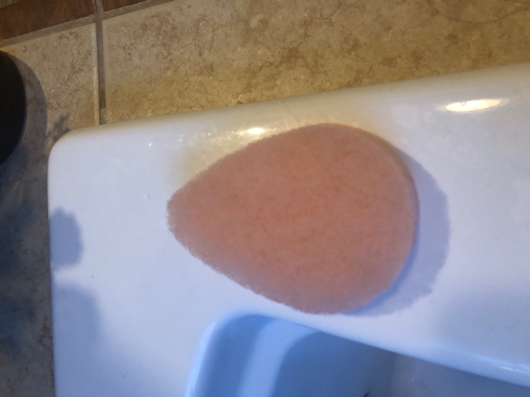 Exfoliation Pad on Side of Bathtub