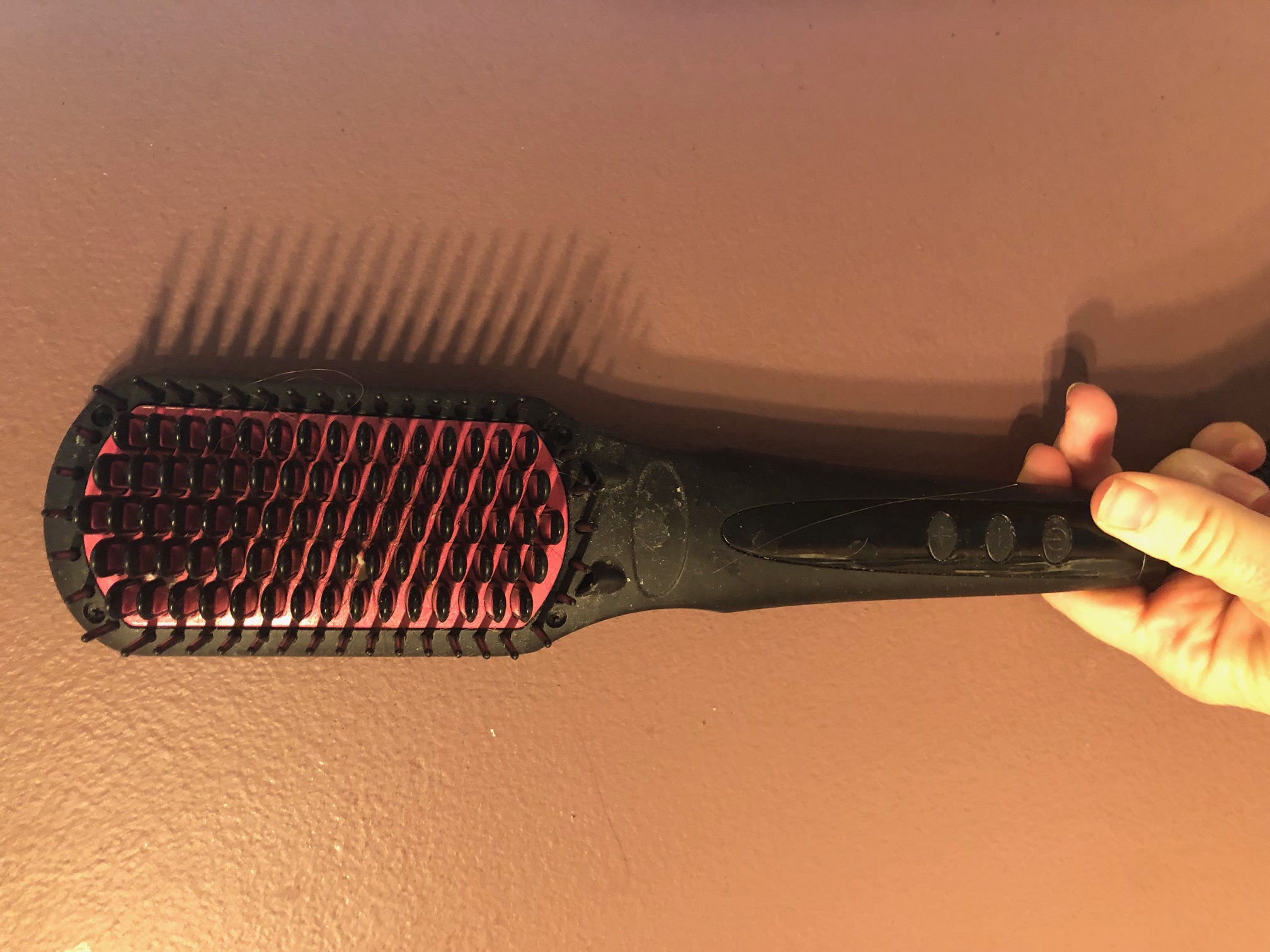 Heated Hair Styling Brush on Rose Background