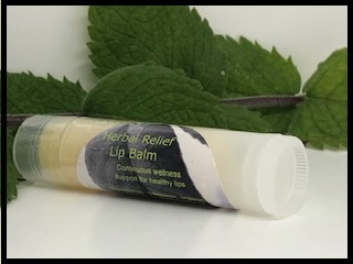 Herbal Relief Lip Balm with Organic Mint Leaves in Background