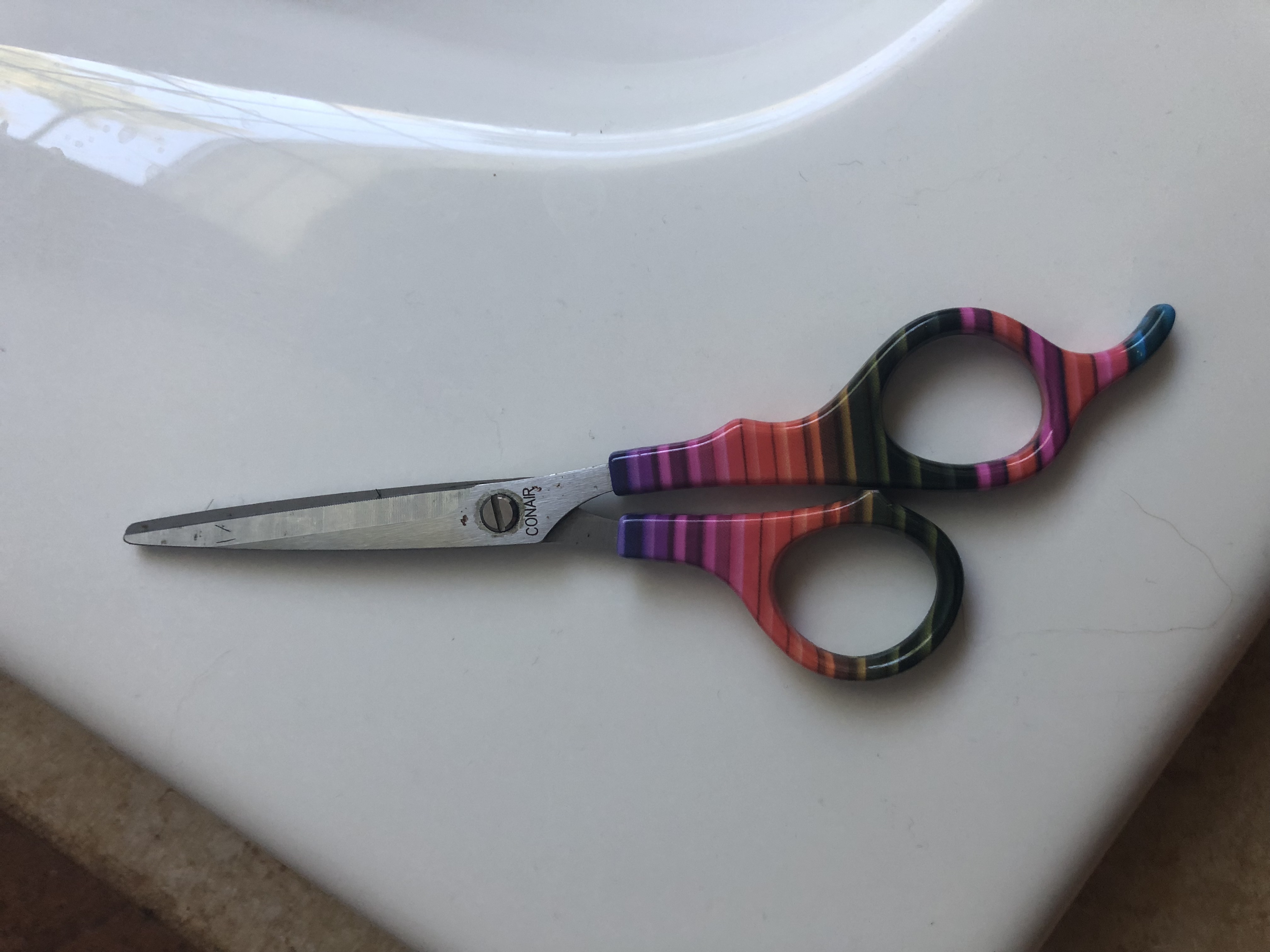 Hair Cutting Shears Multi Colored on a White Enamel Background